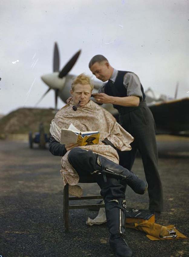 An RAF Pilot getting a haircut during a break between missions, Britain, 1942