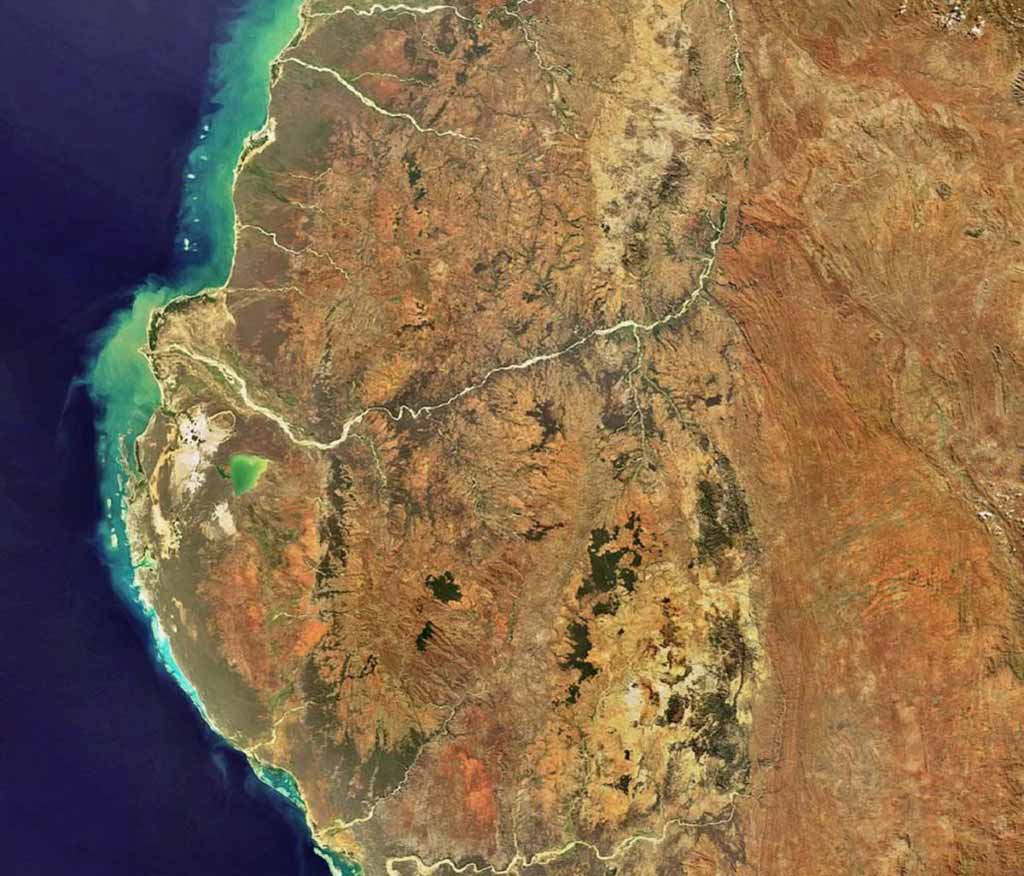 The southwestern area of Madagascar — the fourth largest island in the world — is highlighted in this Envisat image. The green coloured body of water visible just below the Mangoky River is Lake Ihotry. The Isalo National Park, which is located to the right in the image in the burnt orange area.