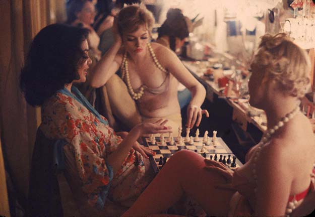Showgirls playing chess backstage at the Latin Quarter nightclub – New York, 1958