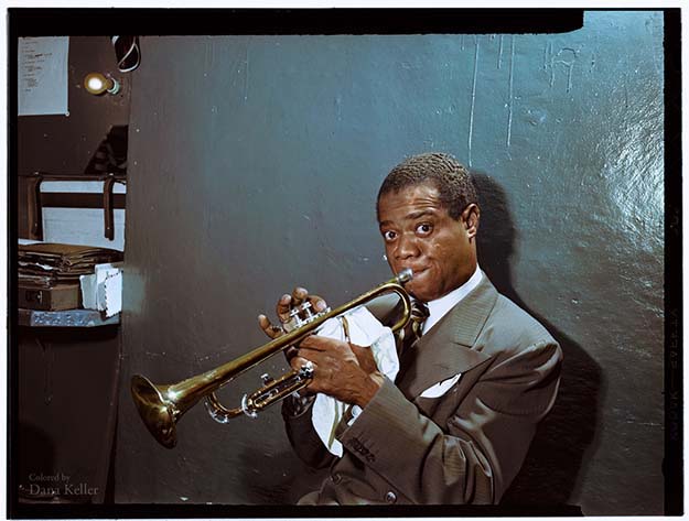Louis Armstrong practicing in the dressing room, ca. July 1946