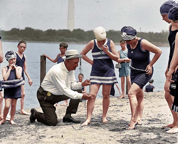 1922, the swimsuit police checking the length of a suit!