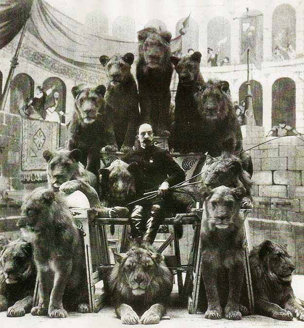 Animal Tamer Captain Jack Bonavita sitting down with some of his cats, ~1870s