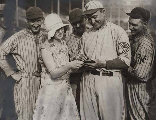 Ty Cobb signing an autograph while on a baseball tour in England, 1929