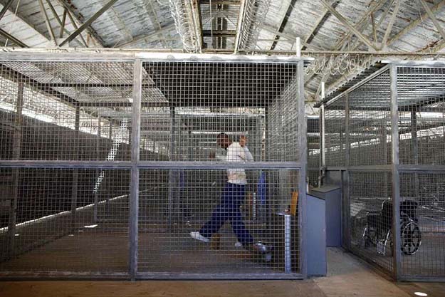 An administrative segregation prisoner exercises at San Quentin state prison