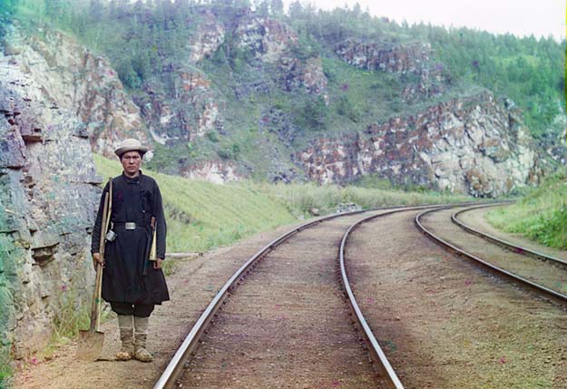 A switch operator poses on the Trans-Siberian Railroad, near the town of Ust Katav on the Yuryuzan River in 1910