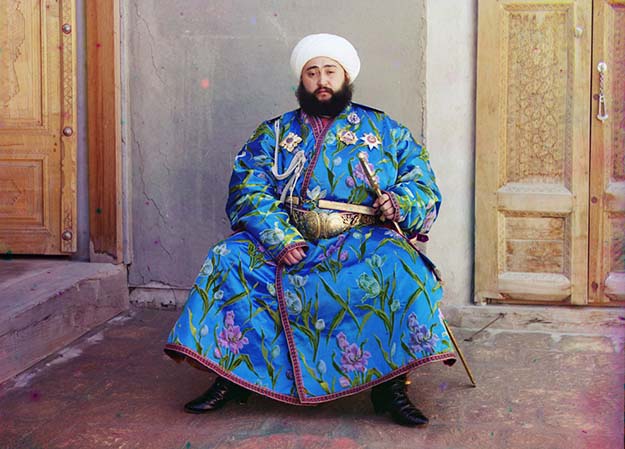 Emir Seyyid Mir Mohammed Alim Khan, the Emir of Bukhara, seated holding a sword in Bukhara, (present-day Uzbekistan), ca. 1910.