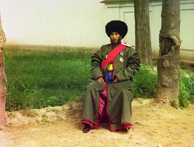 Isfandiyar Jurji Bahadur, Khan of the Russian protectorate of Khorezm (Khiva, now a part of modern Uzbekistan), full-length portrait, seated outdoors, ca. 1910.