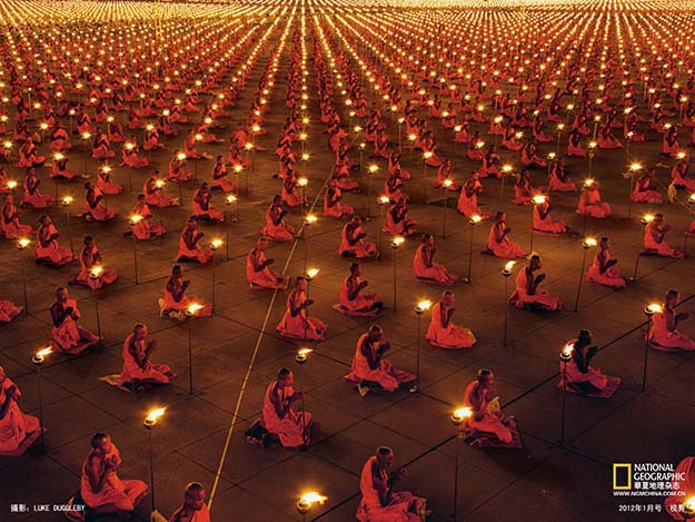 1000s Upon 1000s of Buddhist Monks Kneeling In Meditation