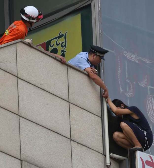 Beijing Cop Handcuffs Himself To Suicidal Woman On Ledge To Save Her Life
