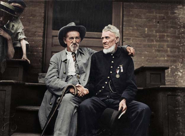 Civil War veterans at Gettysburg anniversary: A Union veteran and a Confederate veteran shake hands at the Assembly Tent, 1913