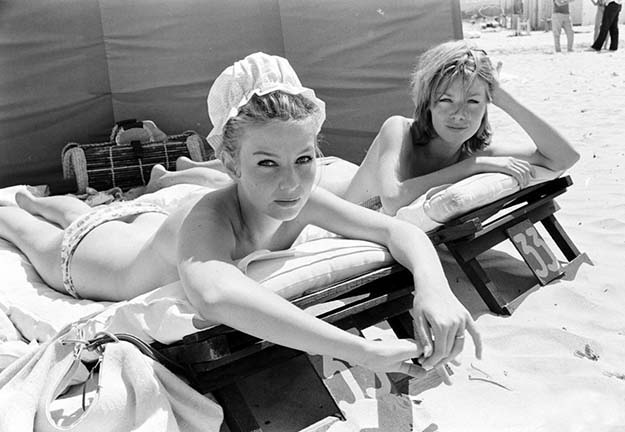 Danish actress Annette Stroyberg sunbathing with a friend