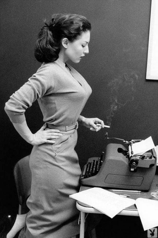 Girl with typewriter and a smoke