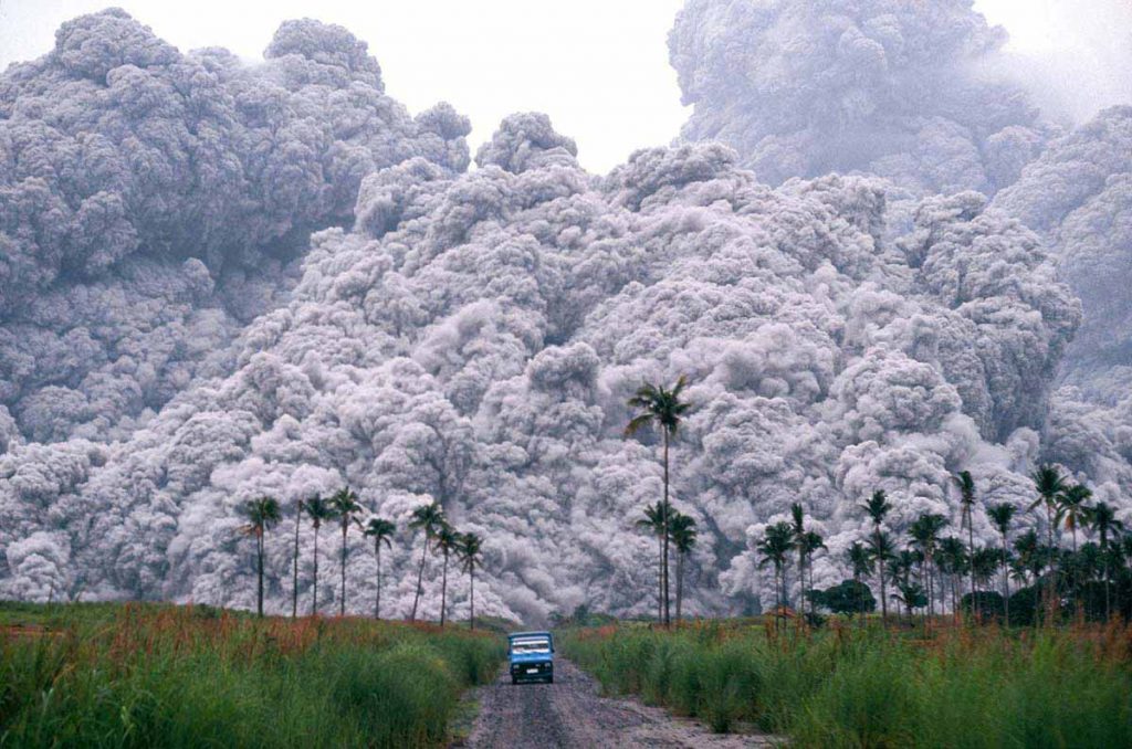 A pickup truck flees from the pyroclastic flows spewing from the Mt.Pinatubo volcano in the Philippines, on June 17, 1991. This was the second largest volcanic eruption of the 20th century