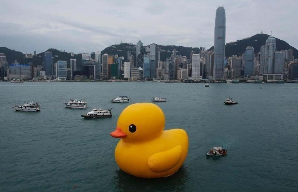 A massive rubber ducky in a city river