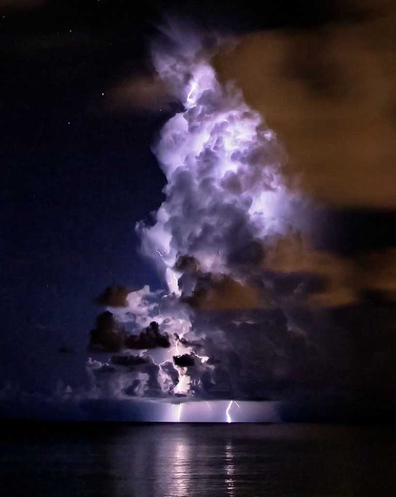 a cloud illuminated by lightning