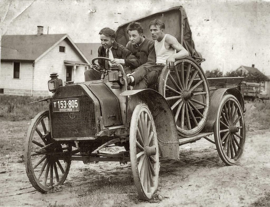 Three young men in a vehicle, c. 1924