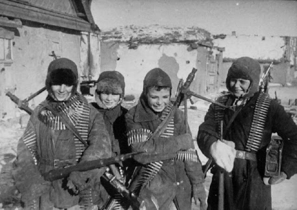 Russian boys at Stalingrad with captured German machine guns, February 1943